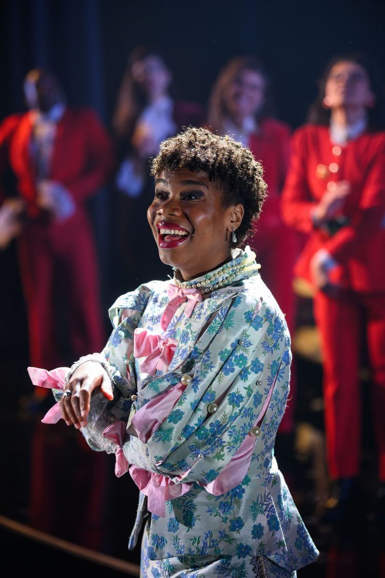 Scene from Orlando - actor smiling in colourful costume